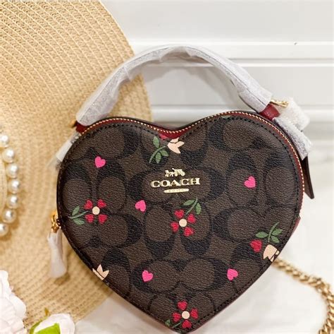 coach heart print handbags.